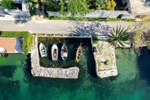 an aerial view of two boats in the water at Villa Shah Complex in Kotor +101 photos