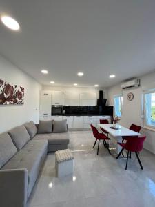 a living room with a couch and a table at Apartments Luce - Dome in Split