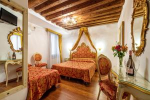 Postel nebo postele na pokoji v ubytování Hotel Al Vagon