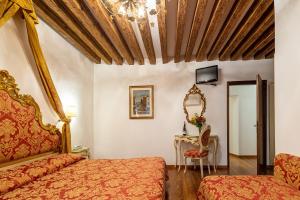 Postel nebo postele na pokoji v ubytování Hotel Al Vagon