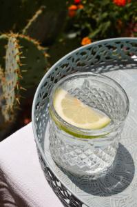 a glass bowl of water with a lemon in it at B&B La Casa Pugliese in Foggia