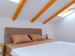 Postel nebo postele na pokoji v ubytování Apartment Dora