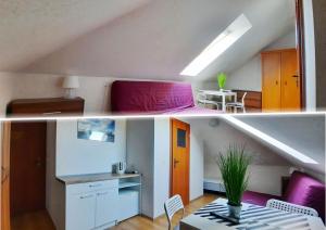 a living room and a kitchen in a loft at Villa Zosia in Rowy