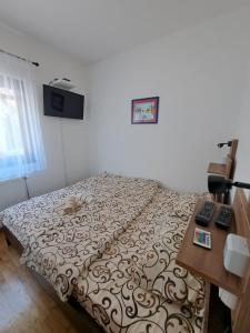 Postel nebo postele na pokoji v ubytování Apartman Helena
