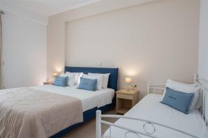 Postel nebo postele na pokoji v ubytování Menes Hotel