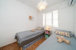 Posteľ alebo postele v izbe v ubytovaní Zélia Rooftop Apartment