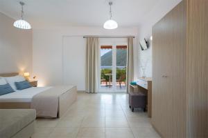 Postel nebo postele na pokoji v ubytování Menes Hotel