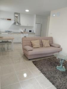 a living room with a couch and a table at Casa Eduardo 1 in El Puente