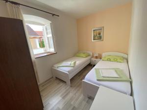 Postel nebo postele na pokoji v ubytování House Lara