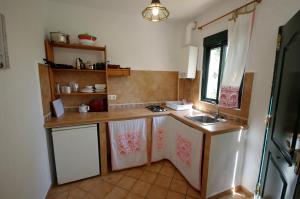 a kitchen with a sink and a counter top at Cancho de Soto 2 in Tarifa