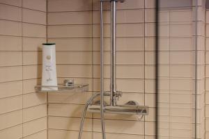 a shower with a faucet in a bathroom at Vanda's Maison in Corfu Town +21 photos