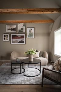 a living room with a couch and a table at Enter Viking Apartment Hotel in Tromsø