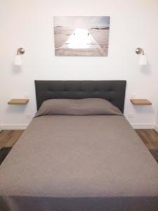 Ένα ή περισσότερα κρεβάτια σε δωμάτιο στο Appartement "Le Clos" pour 4 personnes avec un parking privé