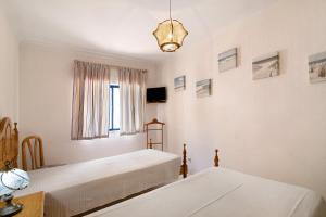 Postel nebo postele na pokoji v ubytování Apartamento T1 Edisol + 16 fotografií