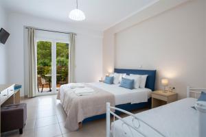 Postel nebo postele na pokoji v ubytování Menes Hotel