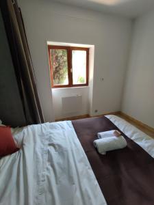 a bedroom with a large bed with a window at Château Saint-Martin in Carcassonne