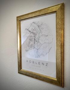 a picture of a map in a frame on a wall at Ferienwohnung Jonathan in Koblenz