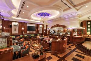 a hotel lobby with a bar and a restaurant at ITC Maurya, a Luxury Collection Hotel, New Delhi in New Delhi