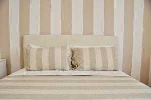 Кровать или кровати в номере M.Aurelio (Nolo) Light Brown