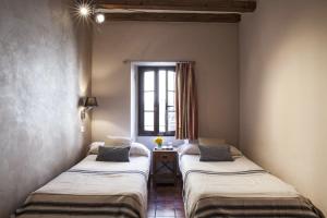 Cama o camas de una habitación en AinB Las Ramblas-Guardia Apartments