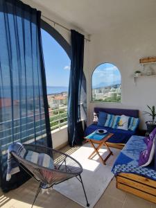 a living room with a view of the ocean at DOROTEA3 in Makarska