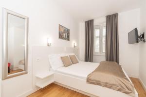 Postel nebo postele na pokoji v ubytování IL Cetro Spalato Rooms