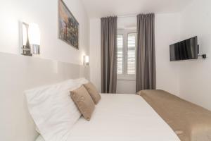 Postel nebo postele na pokoji v ubytování IL Cetro Spalato Rooms