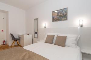 Postel nebo postele na pokoji v ubytování IL Cetro Spalato Rooms