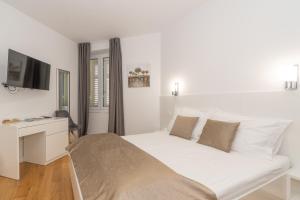 Postel nebo postele na pokoji v ubytování IL Cetro Spalato Rooms