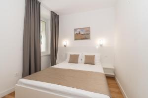 Postel nebo postele na pokoji v ubytování IL Cetro Spalato Rooms