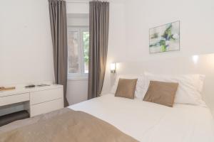 Postel nebo postele na pokoji v ubytování IL Cetro Spalato Rooms