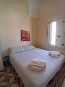 A bed or beds in a room at Casa Paola