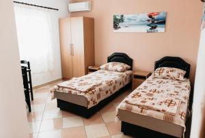 Postel nebo postele na pokoji v ubytování Guest House Lalic
