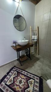 a bathroom with a sink and a mirror on the wall at Casa cu Lavanda in Petroşani +52 photos