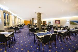 a dining room filled with tables and chairs at besttime Hotel Boppard in Boppard