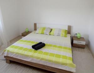 Postel nebo postele na pokoji v ubytování Apartmani Loli