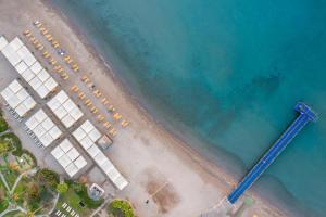 an aerial view of a beach with a group of cars at Selectum Collection Bodrum in Akyarlar