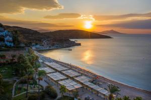 an aerial view of a beach at sunset at Selectum Collection Bodrum in Akyarlar