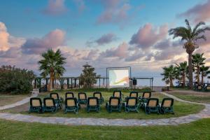 a group of chairs sitting in a park at Selectum Collection Bodrum in Akyarlar