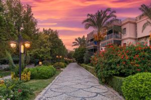 a walkway in front of a building at sunset at Selectum Collection Bodrum in Akyarlar