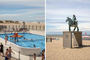 Una statua di un uomo che cavalca un cavallo accanto a una piscina. di Cabien Zeedijk Oostduinkerke a Oostduinkerke