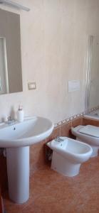 a bathroom with a sink and a toilet at Lovin Puglia Vacation in Bari