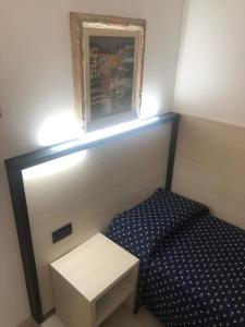 Postel nebo postele na pokoji v ubytování Alloggi Pontecorvo Liviana