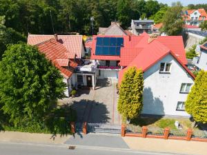 an overhead view of a house with a red roof at Dom Pod Jeleniem in Łeba