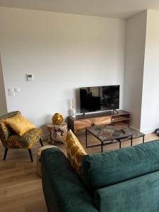 Μια τηλεόραση ή/και κέντρο ψυχαγωγίας στο A 10 mn de Disney Land Paris Appartement neuf