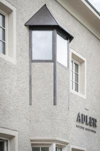 a large window on the side of a building at ADLER Historic Guesthouse in Bressanone