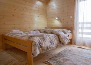 Postel nebo postele na pokoji v ubytování D&S Kovacevic Apartments Zabljak + 40 fotografií