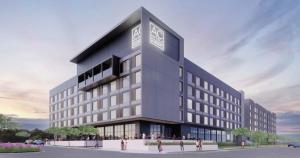 a rendering of a building with a clock on it at AC Hotel by Marriott Lansing University Area in Lansing