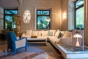 a living room with a couch and a table at Palazzo BelVedere in Montecatini Terme