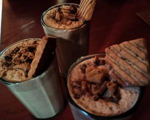 two containers of food sitting on top of a table at Alpine Lodge And Stays in Shangarh